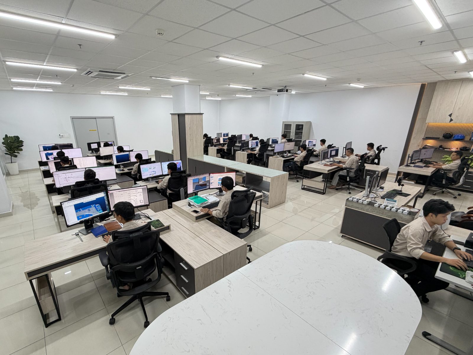Lap Phuc design office — engineers at multi-monitor CAD workstations