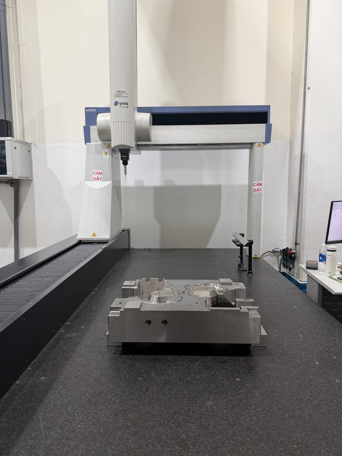 Mitutoyo Crysta Apex CMM measuring a mold